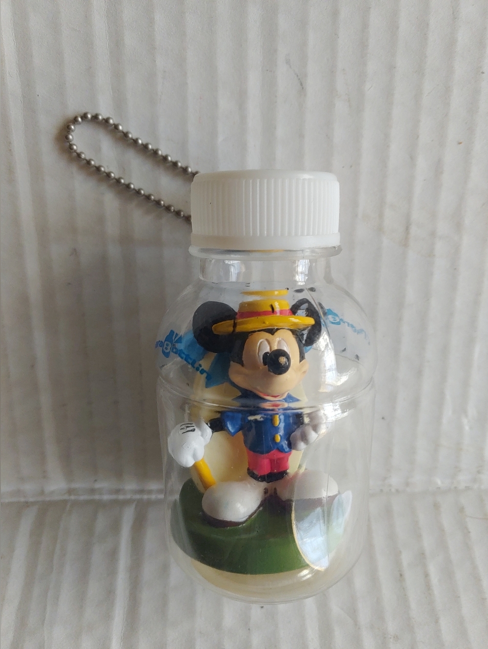 Mickey Mouse figure inside a clear plastic bottle keychain + Collectible